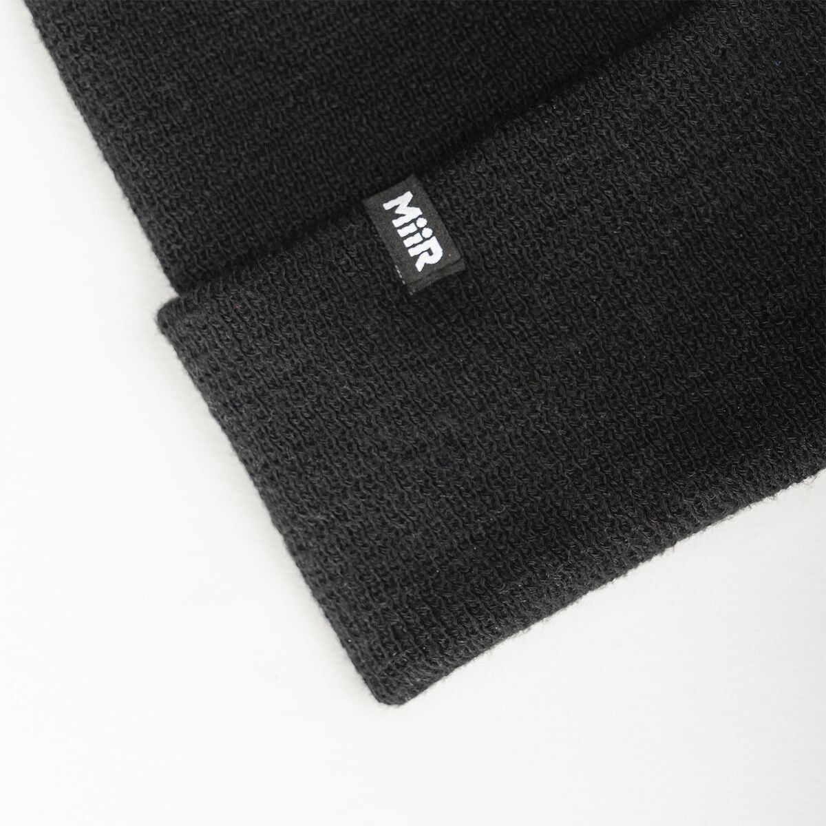 recycled-poly-fine-knit-beanie-g3 WebPDP-RecycledPolyFineKnitBeanie_Studio_TagDetail_Black__BNE005002OS.jpg
