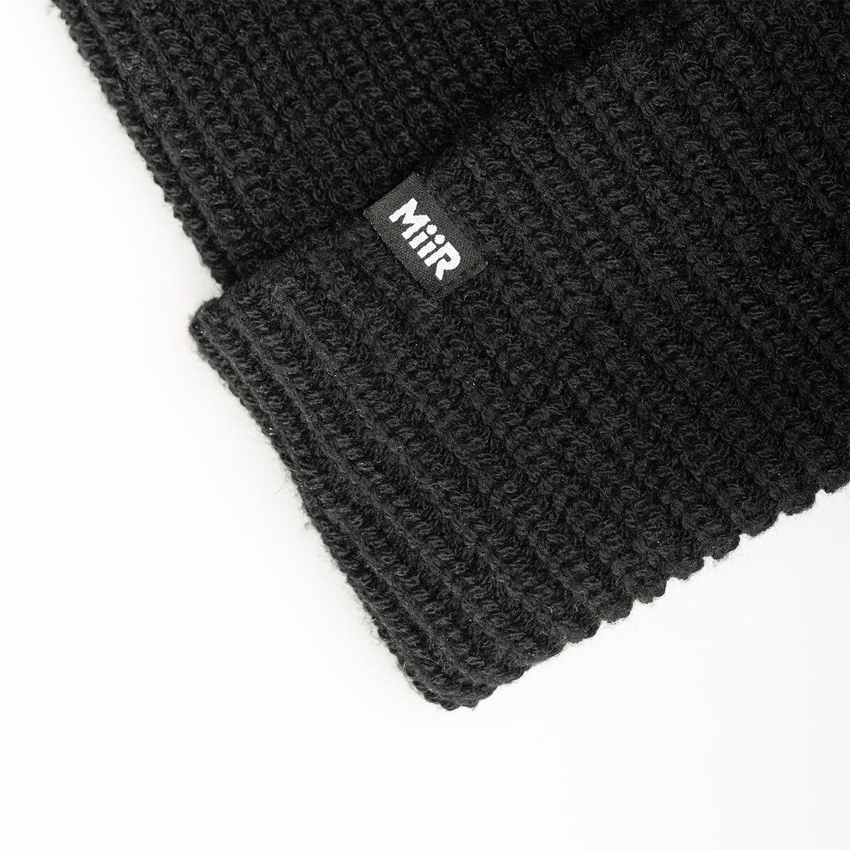 recycled-poly-rib-beanie-a3 WebPDP-RecycledPolyRibBeanie_Studio_TagDetail_Black__BNE002002OS.jpg
